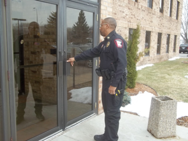 security guard checks a door